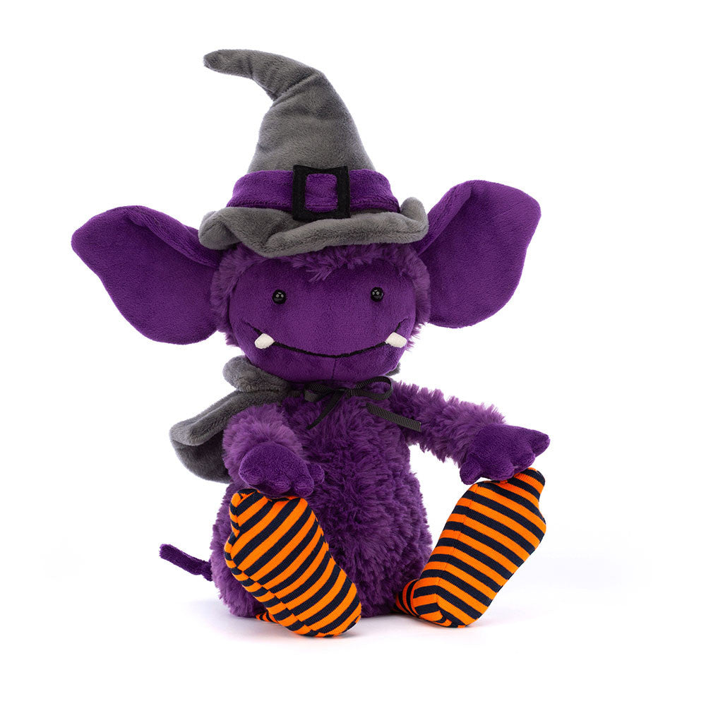 Greta gremlin - purple gremlin - with a grey witches hat - black cape -  orange and black stripy socks - soft toy